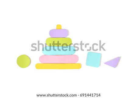 Wooden stacking ring toy paper cut on white background - isolated