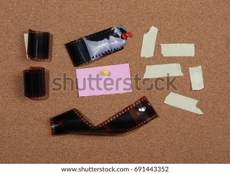 Filmstrip on cork bulletin board background and texture