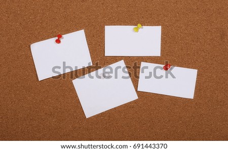 Sticky notes pinned on cork bulletin board background and texture