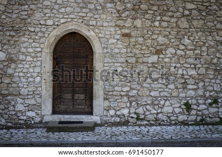 Ancient door in a stone wall
