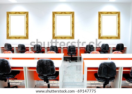 Empty gold photo frames in modern room