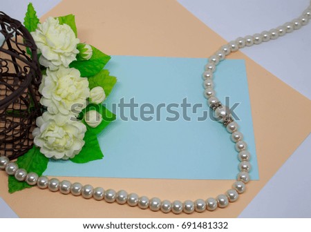 Artificial jasmine flowers ,Pearl necklace and with copy space