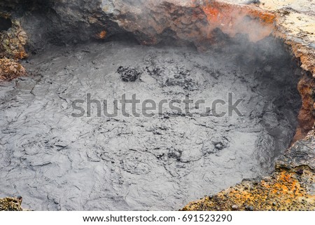 Detail of crater Volcanic mud pools in Azores surrounded by hot spring with steam