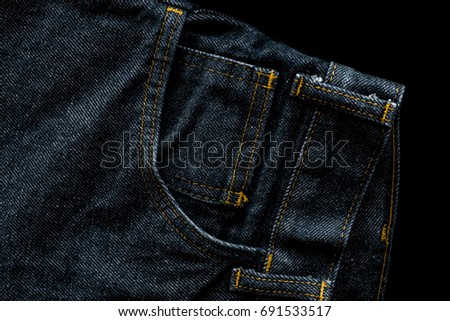 Dark blue jeans on black