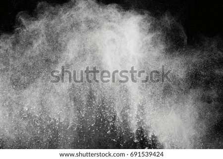 abstract powder splatted background,Freeze motion of color powder exploding/throwing color powder,color glitter texture on black background
