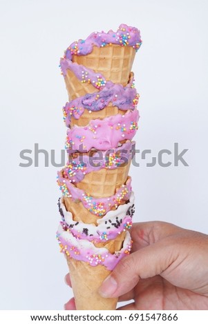 Sweet ice cream cone with sugar decoration.
