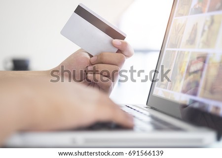 Credit card use to shopping by Business women with lab top computer.
