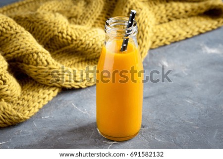 Autumn concept Bottle of pumpkin juice 