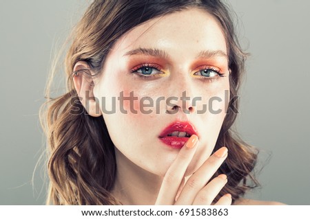 Colorful make-up woman face, beautiful brunette summer makeup, beauty fashion girl model with pink lips. Gray background. Royalty-Free Stock Photo #691583863