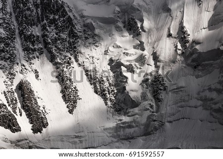 Closeup detail of mountain glacier with rocks