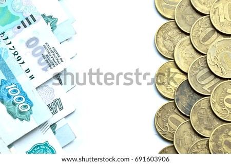 rows of banknotes and coins isolated on white background