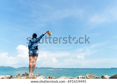 Happy and relax woman on the beach in summer day.  Travel Concept.
