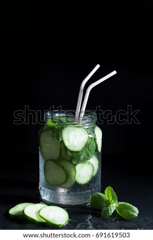 Cocktail of cucumbers in a jar