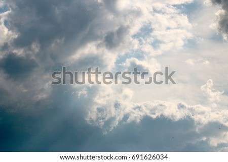 Beautiful sunny clouds on a stormy sky