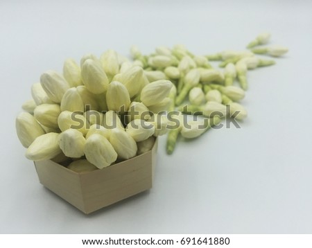 Jasmine in Little Basket on White Background Royalty-Free Stock Photo #691641880