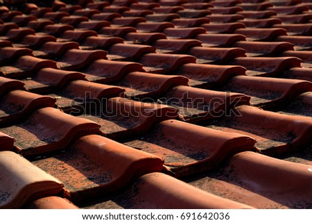 Background texture vintage ceramic dark red tiles closeup the roof of the shallow depth of field