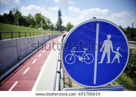 Trail and sign for bicycles and pedestrians.