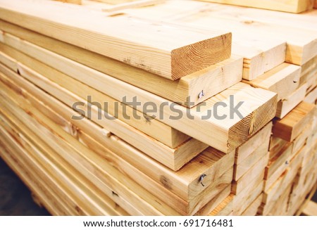 Wooden planks, lining, boards for construction works Royalty-Free Stock Photo #691716481