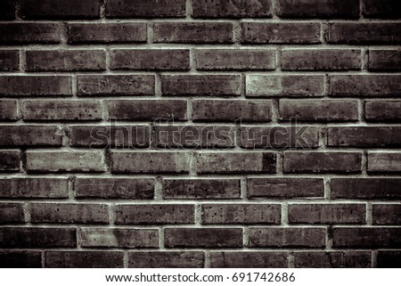 Black and white color or dark purple tone bricks wall background and texture for design and architect, Beautiful brick wall texture, Modern brick wall, Dark color on edge of picture, Close up 