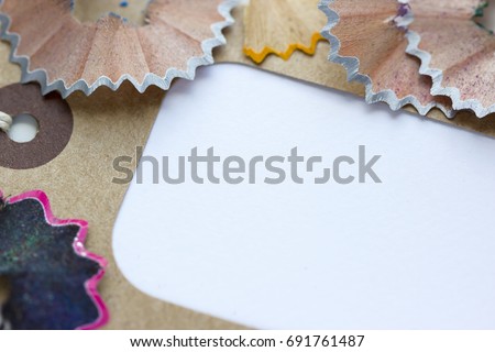 Creativity Concept Image of shaped wood Chips and Shavings of sharpening a 
pencil. In the sale price tag background. Macro View. ART Background concept