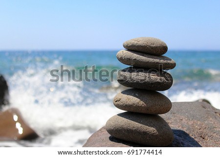 Smooth Stones Stacked on Greek Island Beach