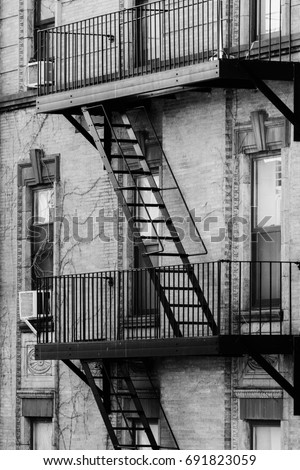 Fire escapes. Design details of Modern and Classic Architecture in Manhattan. Photographed in black and white.