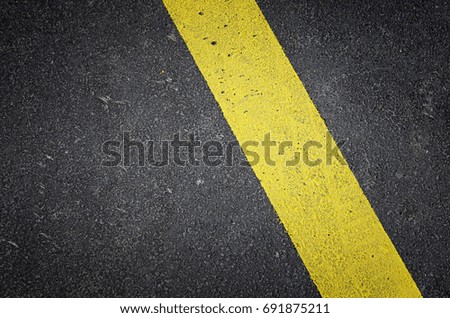 Asphalt road background with yellow line