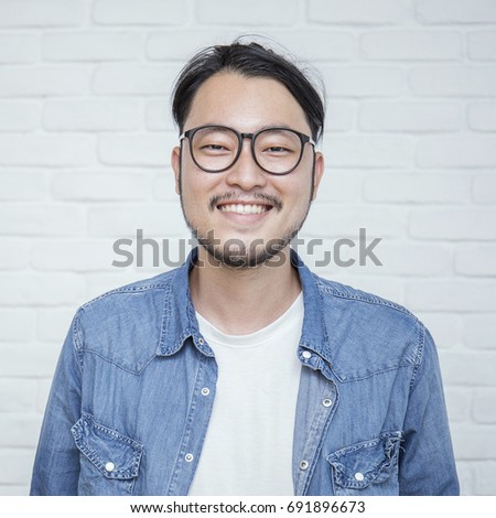 Attractive positive man - close up portrait asian nerdy man