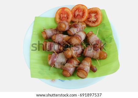 Isolate Dicut photography. Fried Sausage with bacon roll.