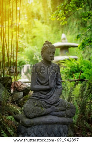 Asian statue of god Buddha in forest