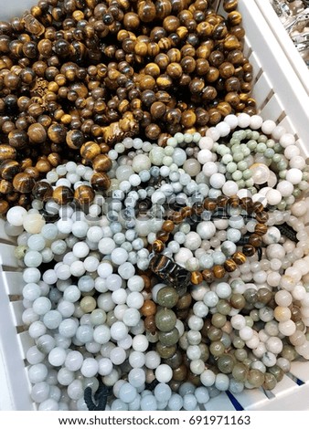 beautiful jewelry made of precious stones on a shelf in a store