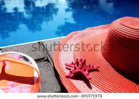 Summer female hat and vetnamki at the blue pool. Summer and rest. 