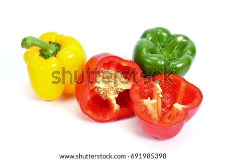 Green , yellow and red  Fresh bell pepper [capsicum] Cut in half isolated on white background.