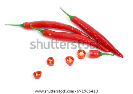 Red chilli or chili peppers cut into pieces isolated on a white background. Royalty-Free Stock Photo #691985413