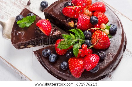 Chocolate cake with fresh different berries