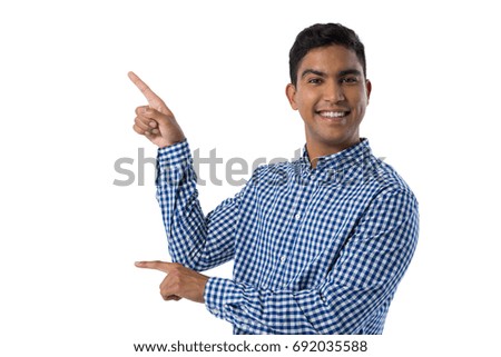 Happy man gesturing against white background