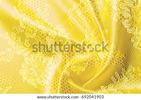 Background texture, pattern. Lace is yellow fabric.