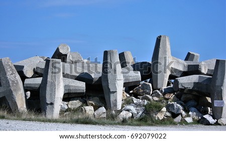 ikes,Geometric and artistic composition of concrete blocks that are used to provide the seaports with a base and a wall strong enough to withstand the giant waves that break in the breakwater,texture,