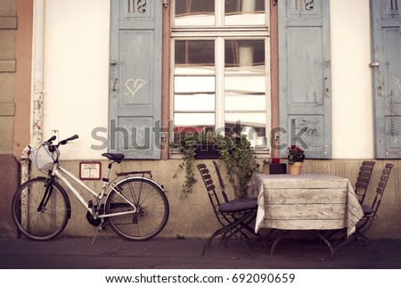 Old European Cafe With Bicycle - Travel Background Royalty-Free Stock Photo #692090659