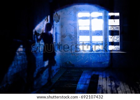 The shadow of a lone woman in an abandoned old ruined house Ghost