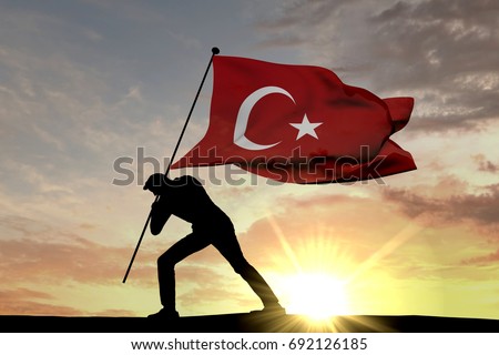 Turkey flag being pushed into the ground by a male silhouette. 3D Rendering Royalty-Free Stock Photo #692126185