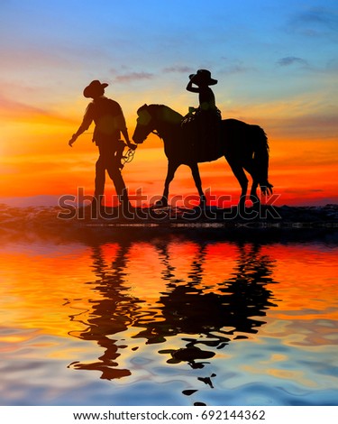  silhouette, girl riding a horse on the beach and water reflection.
