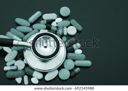 Stethoscope and many drugs close up