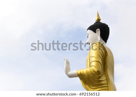 Standing buddha statue. at Wat Phra That Doi Kham in Chiang Mai.