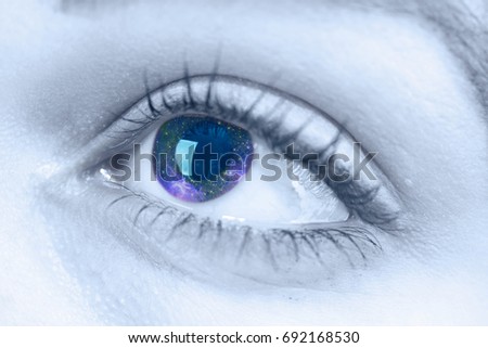 Galaxy reflection in a woman's eye