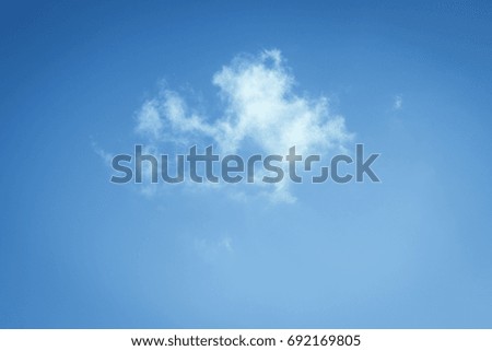 White fluffy clouds in the blue sky. 