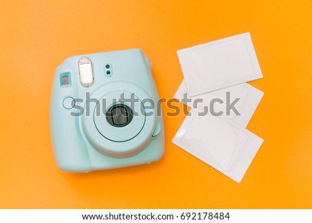 Blue mint instant camera with film