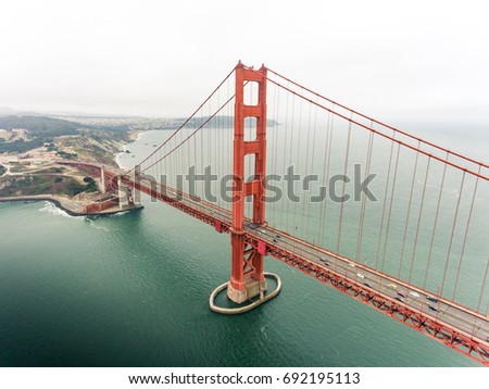 Aerial view of Golden Gate Bridge in warm tone, famous landmark in San Francisco