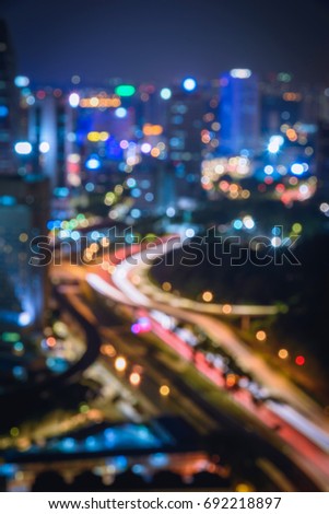 Blurred abstract background lights, beautiful cityscape view of Kuala lumpur city skyline at night in Malaysia.