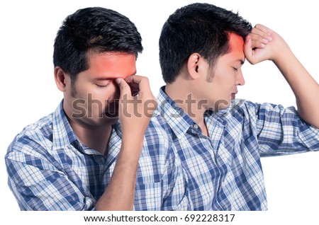 young man holding his head in pain. photo with red as a symbol for the hardening. isolated on white background.